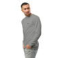 Man wearing a gray long-sleeve shirt, looking sideways.