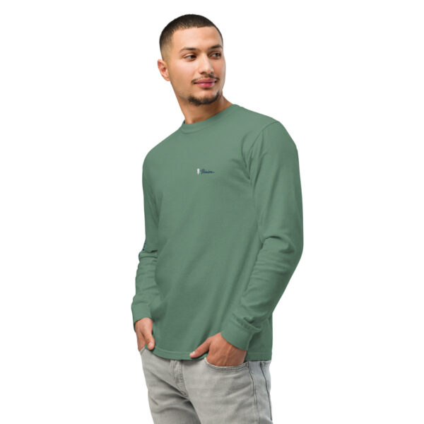 unisex-garment-dyed-heavyweight-long-sleeve-shirt-light-green-left-front-68e0066689348.jpg Man models green long-sleeve shirt with logo.