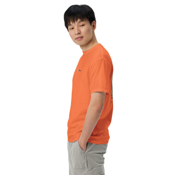 unisex-garment-dyed-heavyweight-t-shirt-burnt-orange-left-691cebbc01fc9.jpg Person wearing orange shirt and gray shorts, looking sideways.