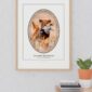 Golden Retriever framed photo on wall near plant.