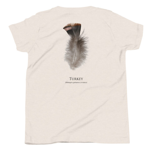 youth-staple-tee-heather-dust-back-69a6e84d8a238.jpg T-shirt with turkey feather illustration and text