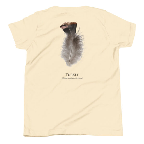 youth-staple-tee-natural-back-69a6e84d8a4d3.jpg Turkey feather illustration on beige shirt back.